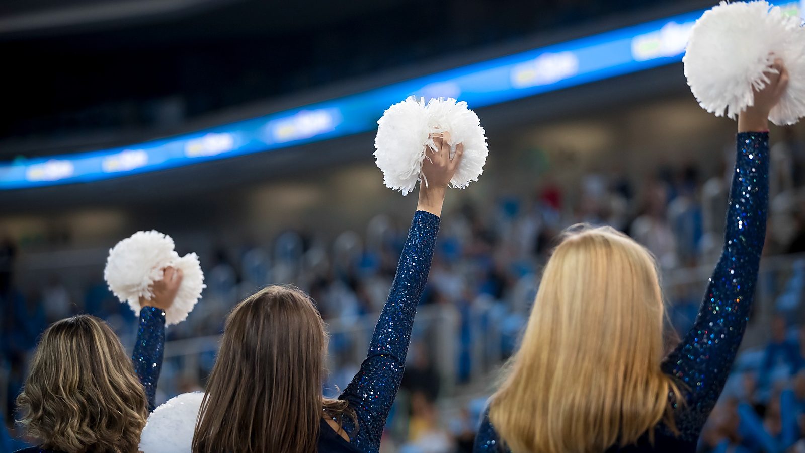 Professional cheerleaders performing during a game